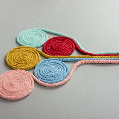 Multicoloured cords twisted into spirals